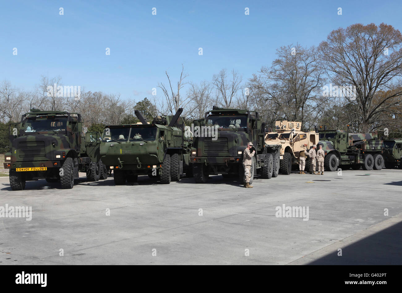 Military trucks lined up prior to refueling. Stock Photo