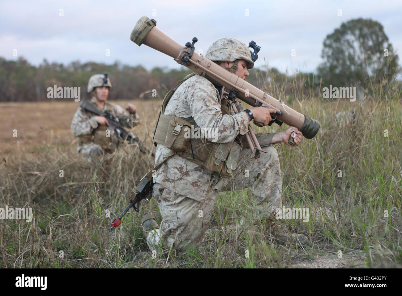 Marines conduct a simulated attack using assault weapons. Stock Photo