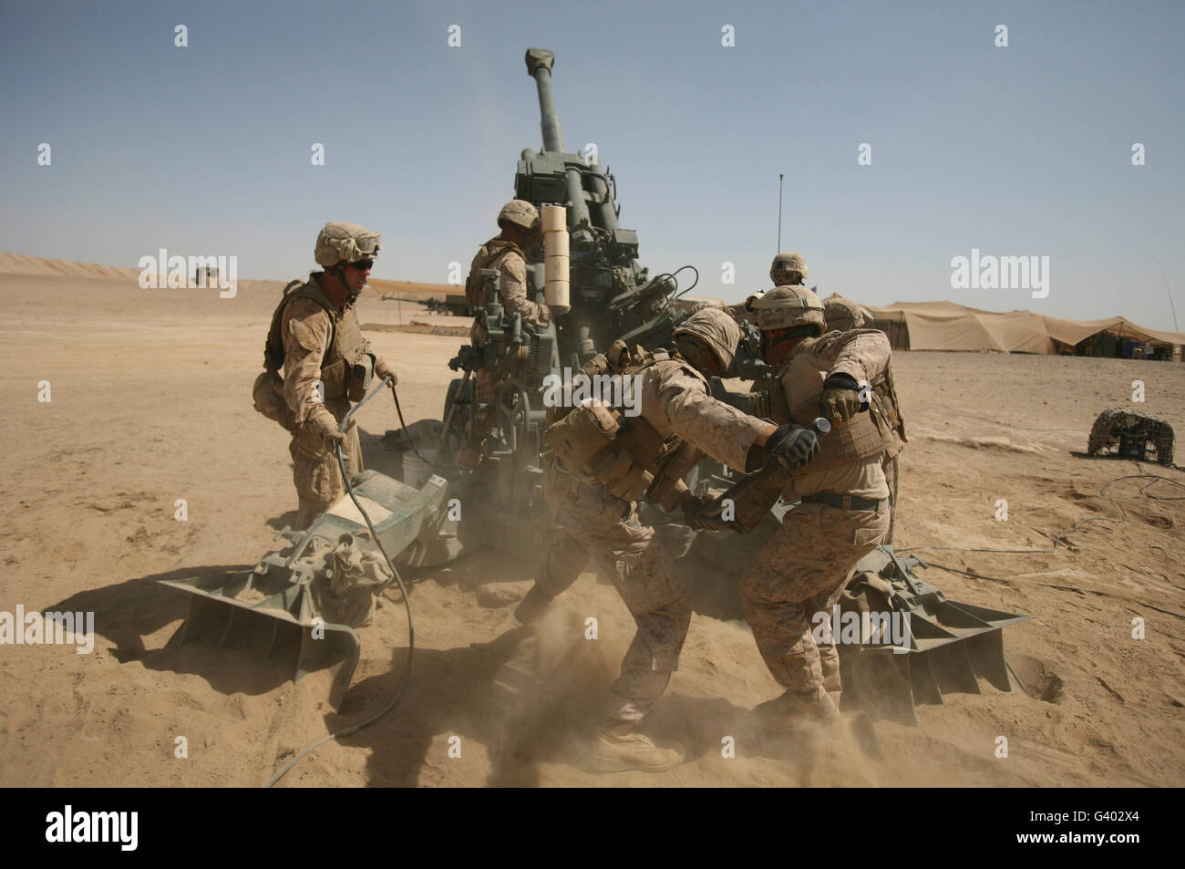 U. S. Marines ram a satellite-guided Excalibur XM982 Precision Engagement Projectile. Stock Photo