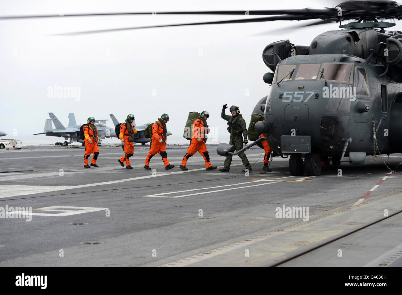 Sailors board an MH-53E Sea Dragon aboard USS George H.W. Bush. Stock Photo