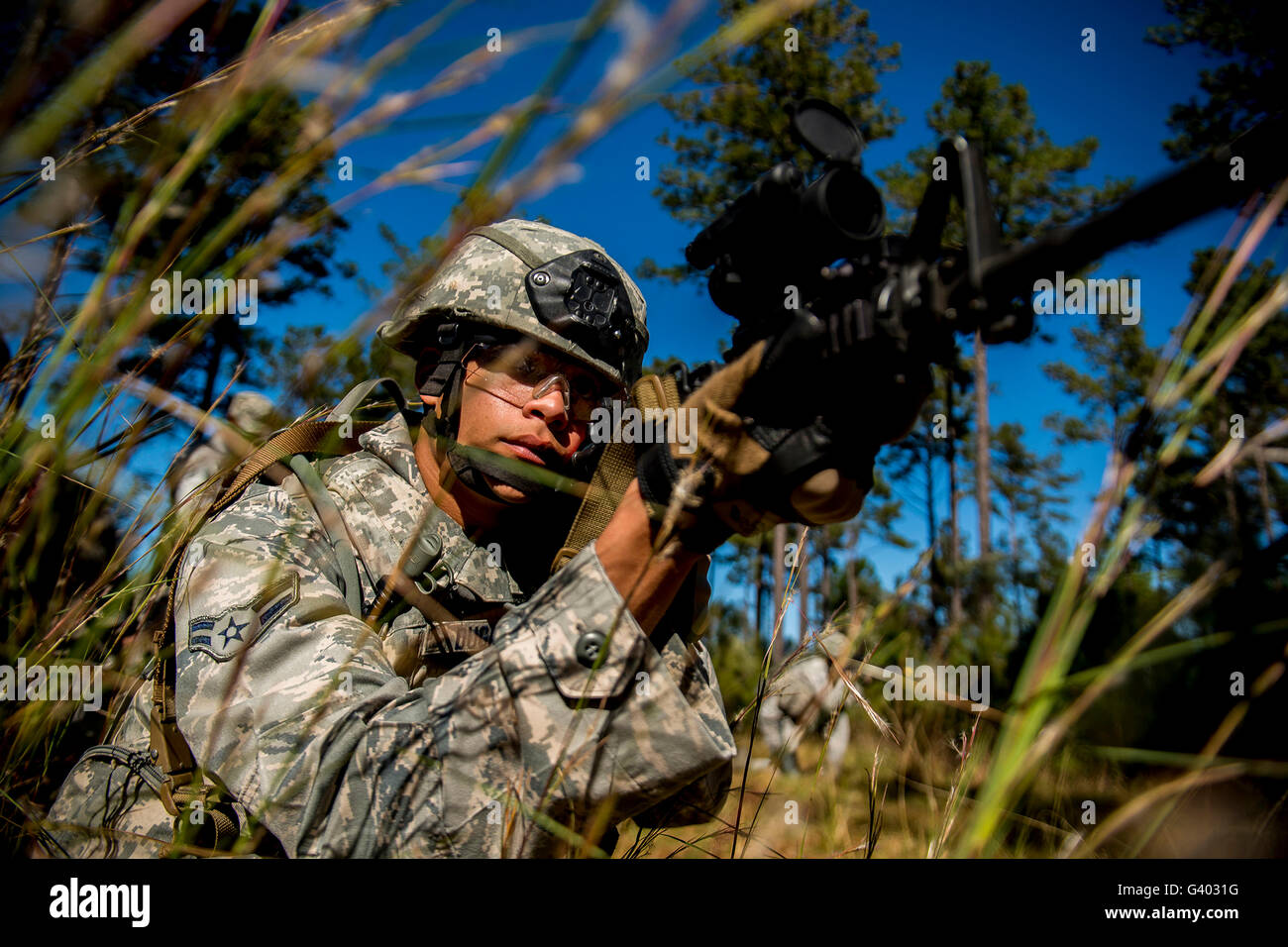 Airman aims an M-4 assault rifle. Stock Photo