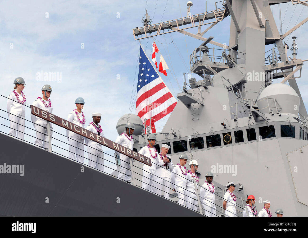 Sailors man the rails aboard USS Michael Murphy. Stock Photo