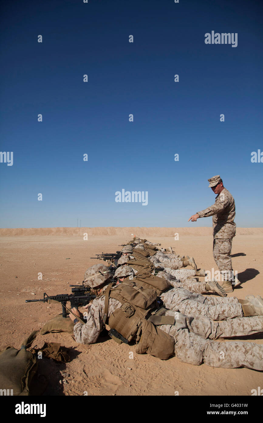 U.S. Marine Corps Officer directs his Marines while battle sight zeroing. Stock Photo