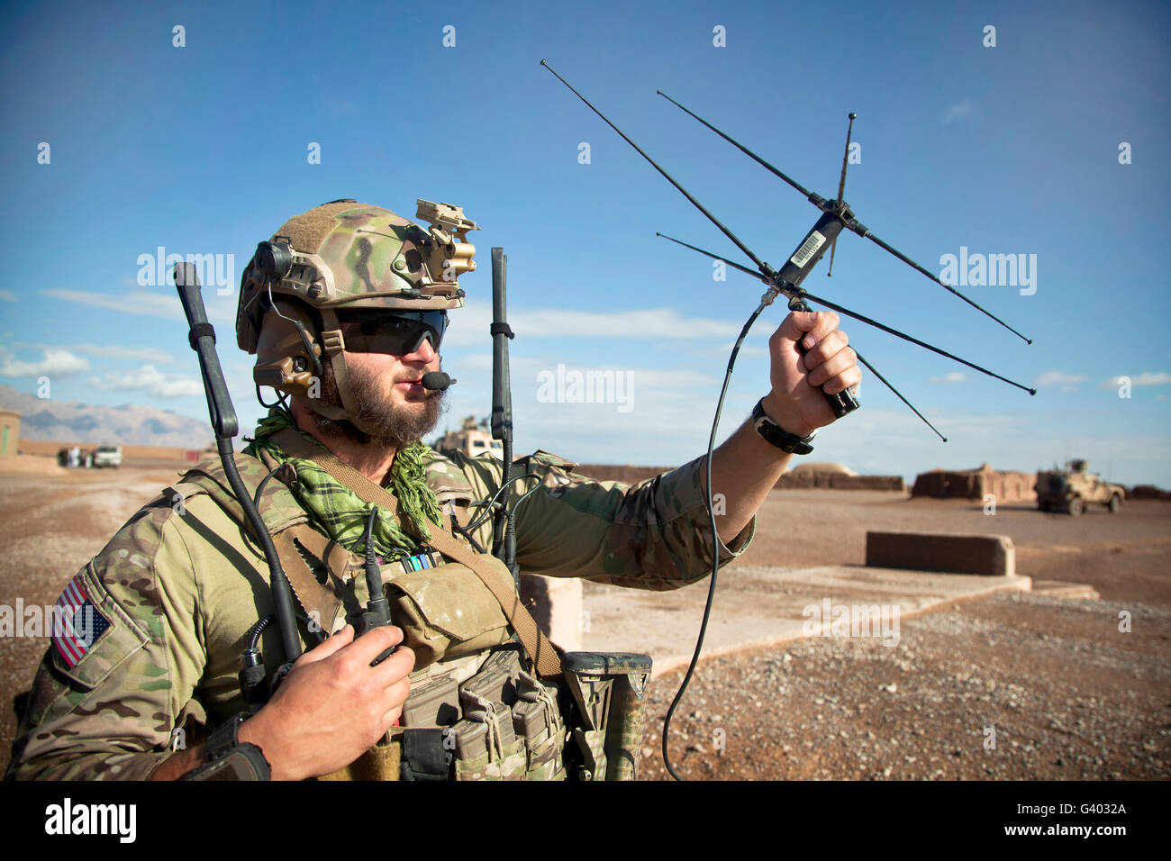 A coalition force member maintains communication during a security ...