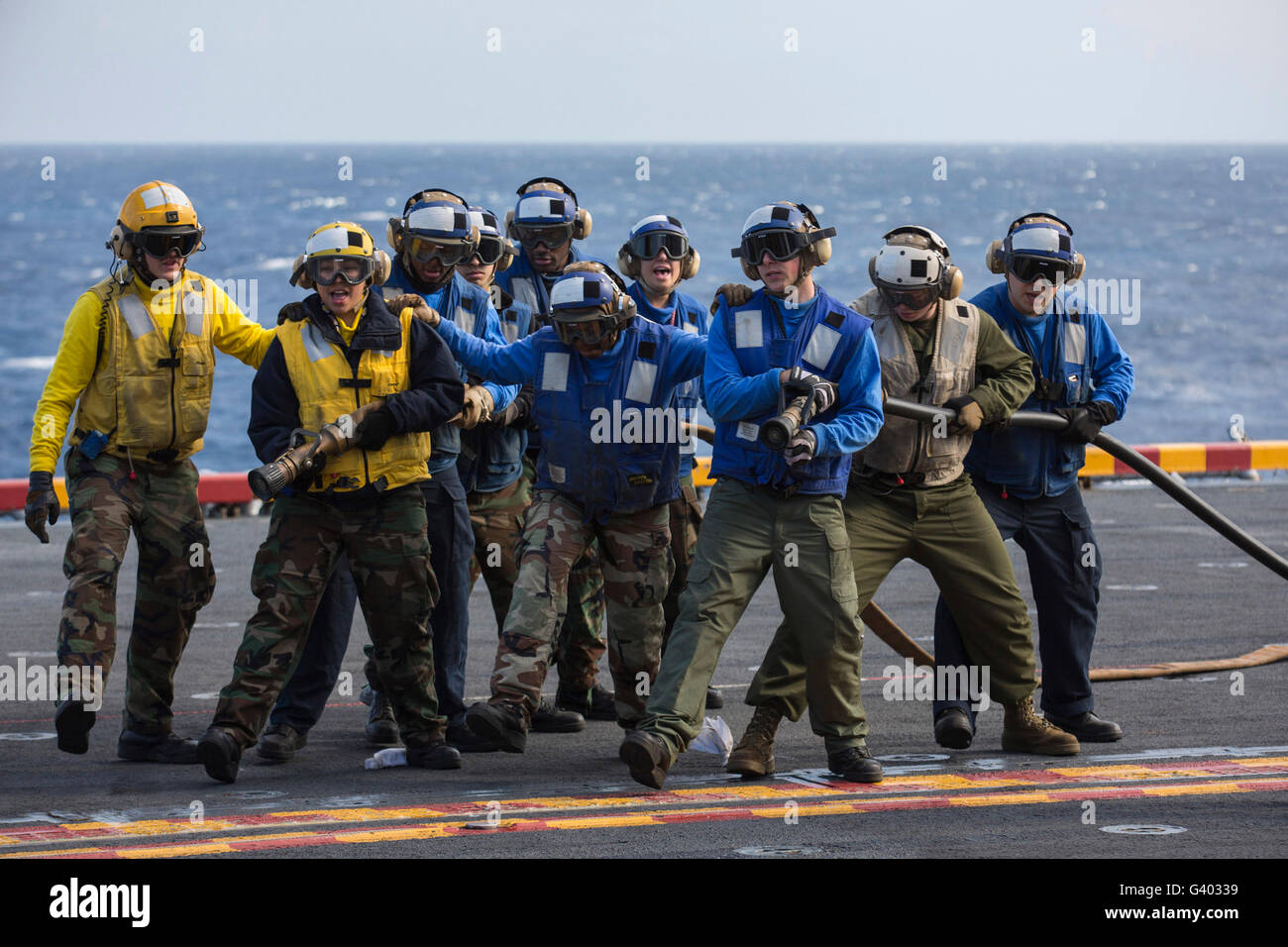 Sailors practice firefighting techniques aboard USS Kearsarge. Stock Photo