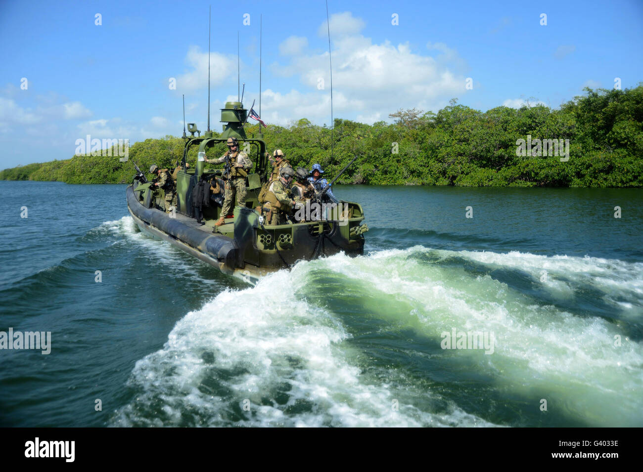 U.S. Sailors transit to a rendezvous point with Belizean service members. Stock Photo