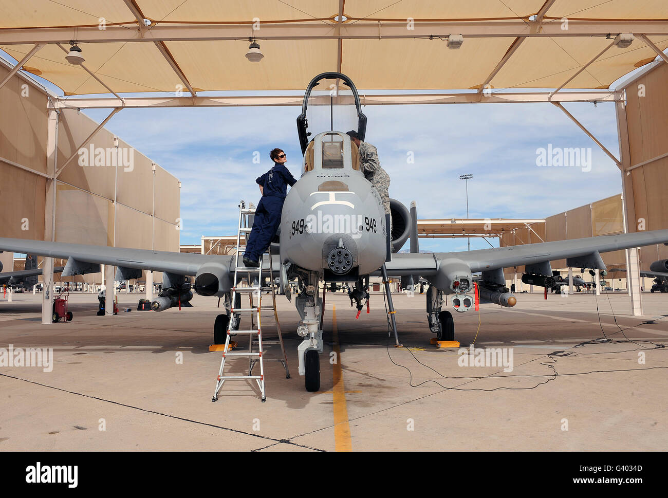 Airmen perform pre-flight checks on an A-10 Thunderbolt II. Stock Photo