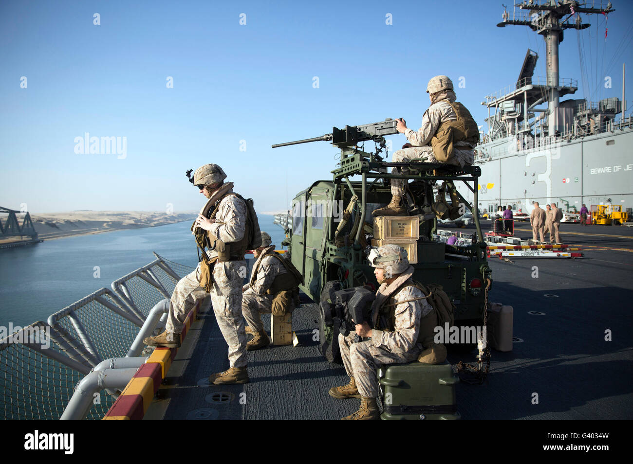 U.S. Marines stand armed watch on the flight deck of USS Kearsarge. Stock Photo