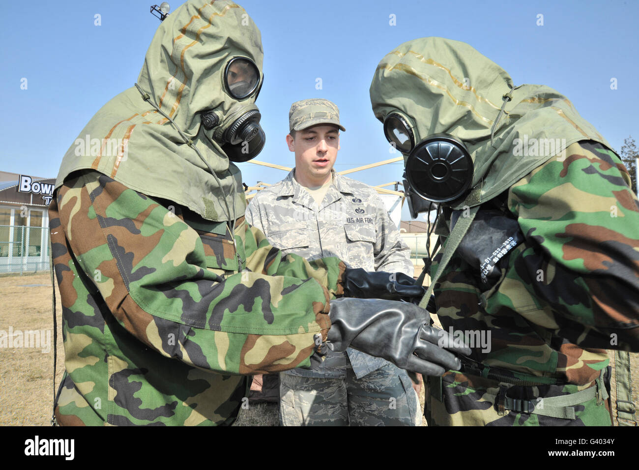 South Korean service members in mission oriented protective posture suits. Stock Photo