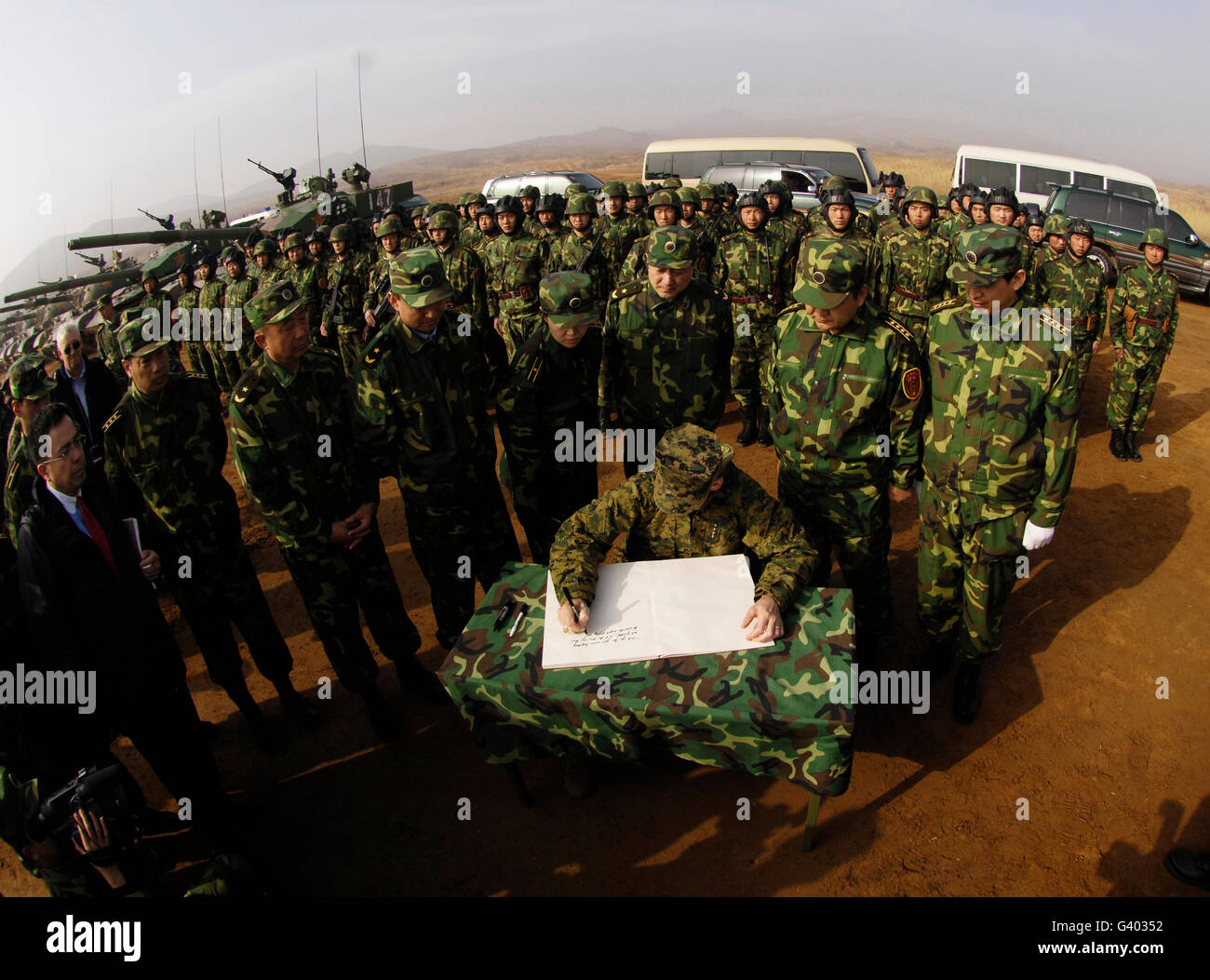 General Peter Pace signs a message for members of the People's Liberation Army. Stock Photo