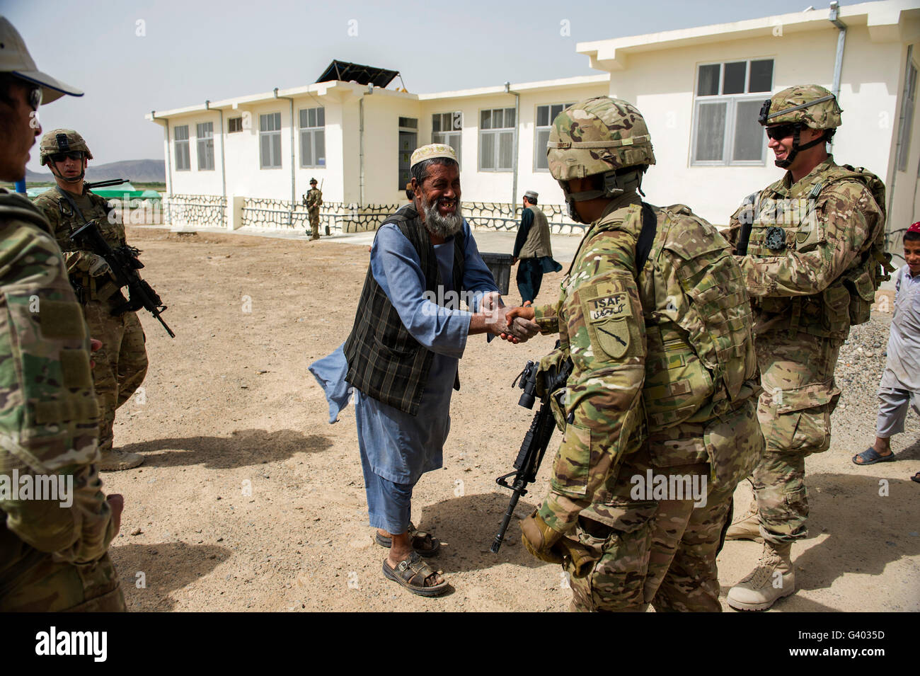 Members of the Kentucky National Guard meet with local Afghans. Stock Photo