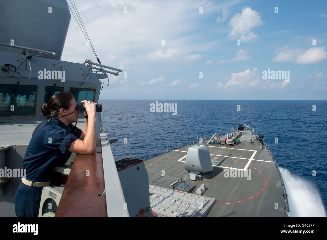 Officer of the deck monitors nearby shipping traffic aboard USS Mahan