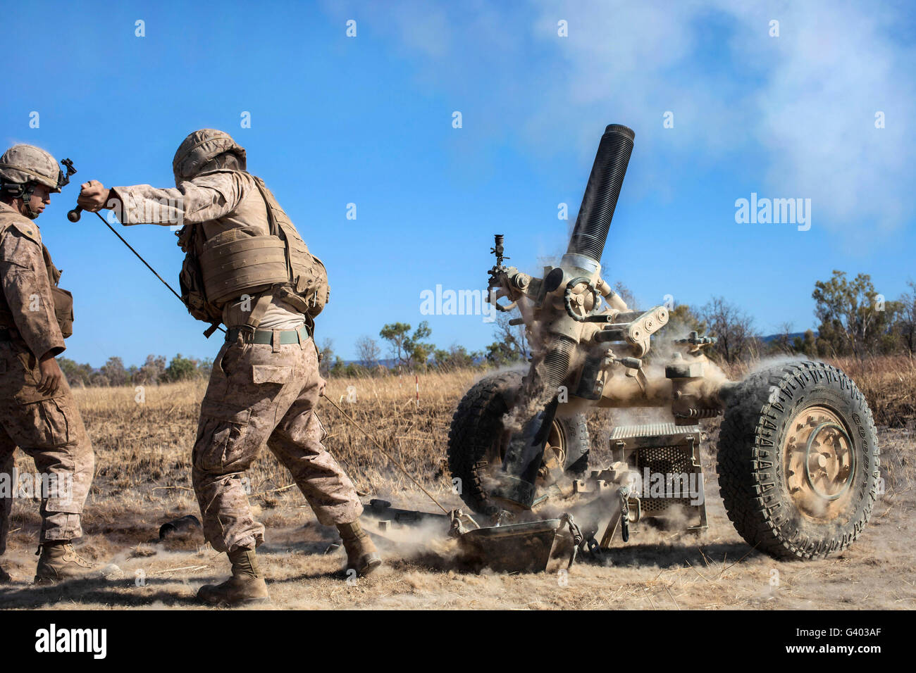Marines fire a 120mm mortar. Stock Photo