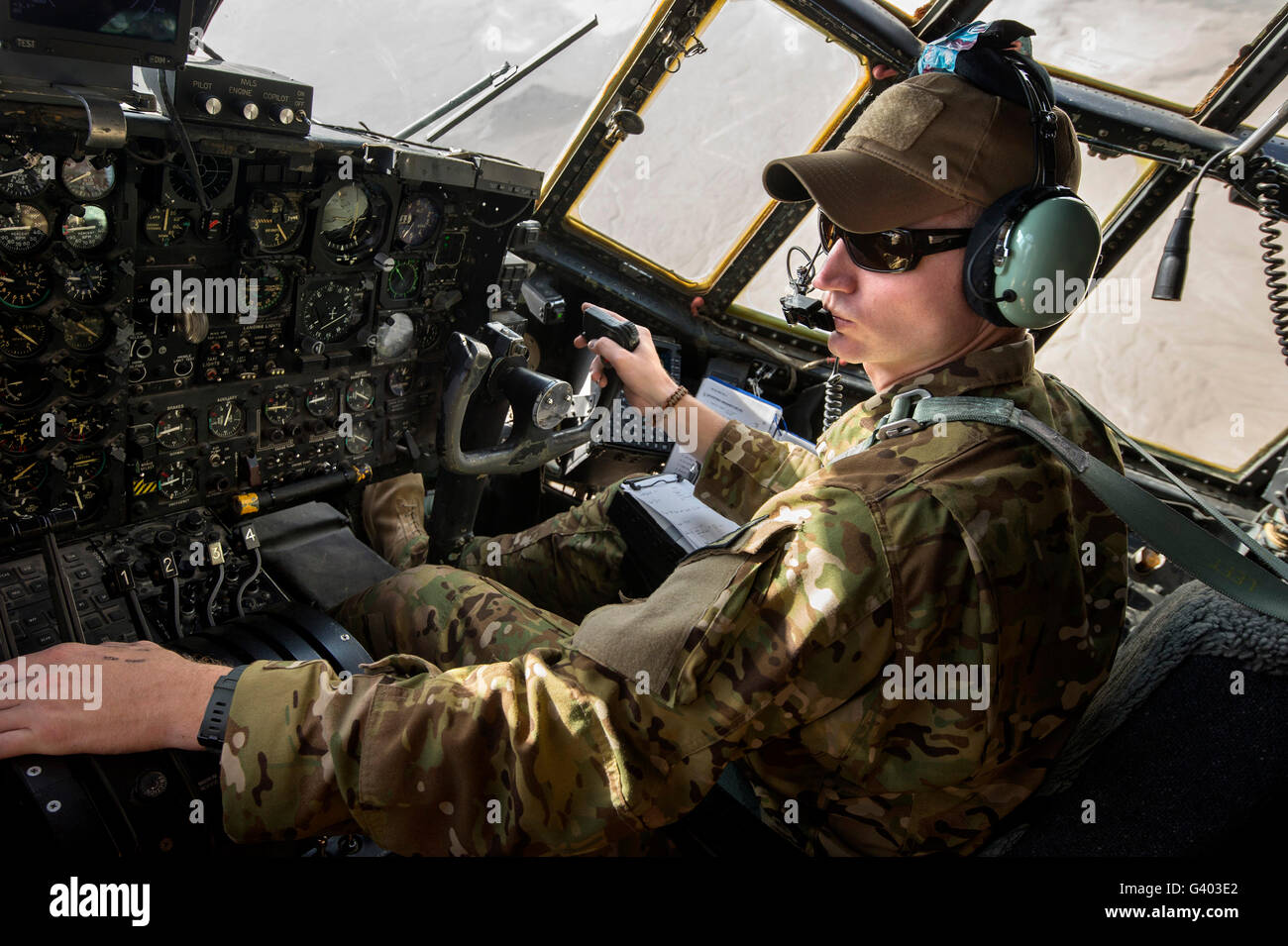 A pilot maneuvers a C-130 Hercules. Stock Photo