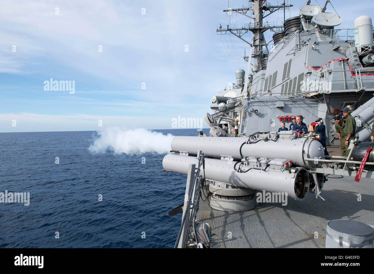 Sailors fire an air slug from a torpedo tube aboard USS Stout. Stock Photo