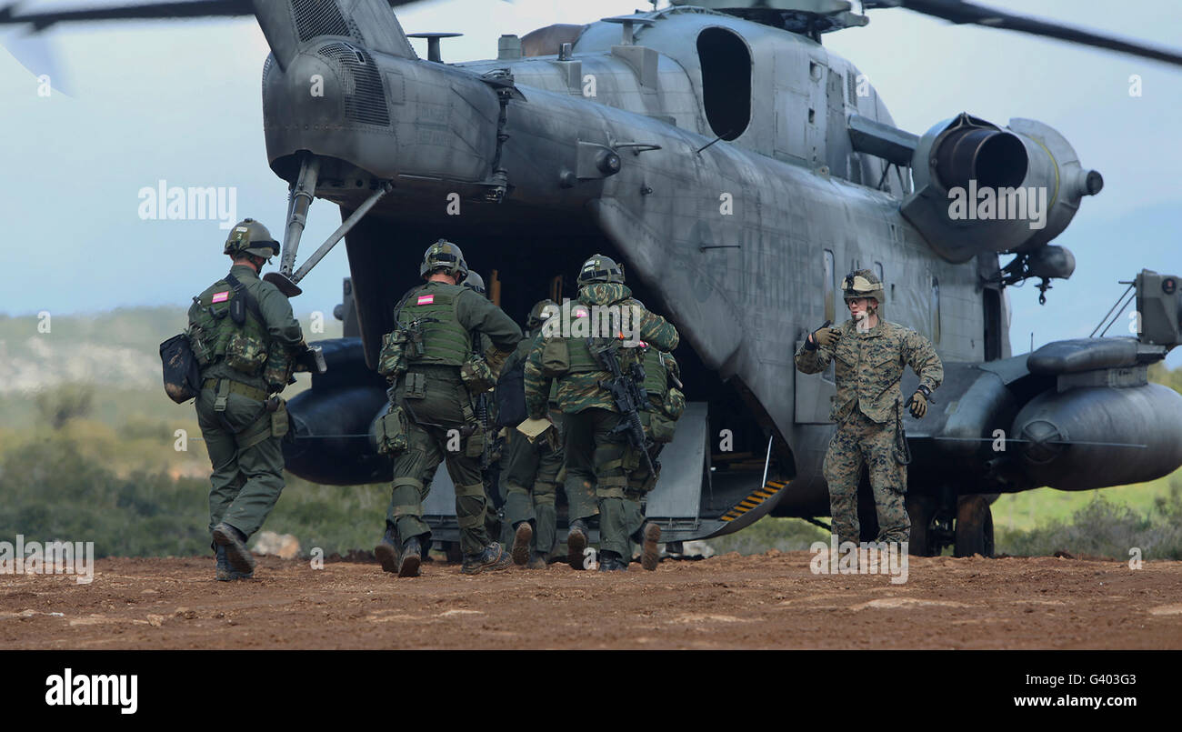 U.S. Marines and members of the Hellenic Army board a CH-53E Super Stallion. Stock Photo