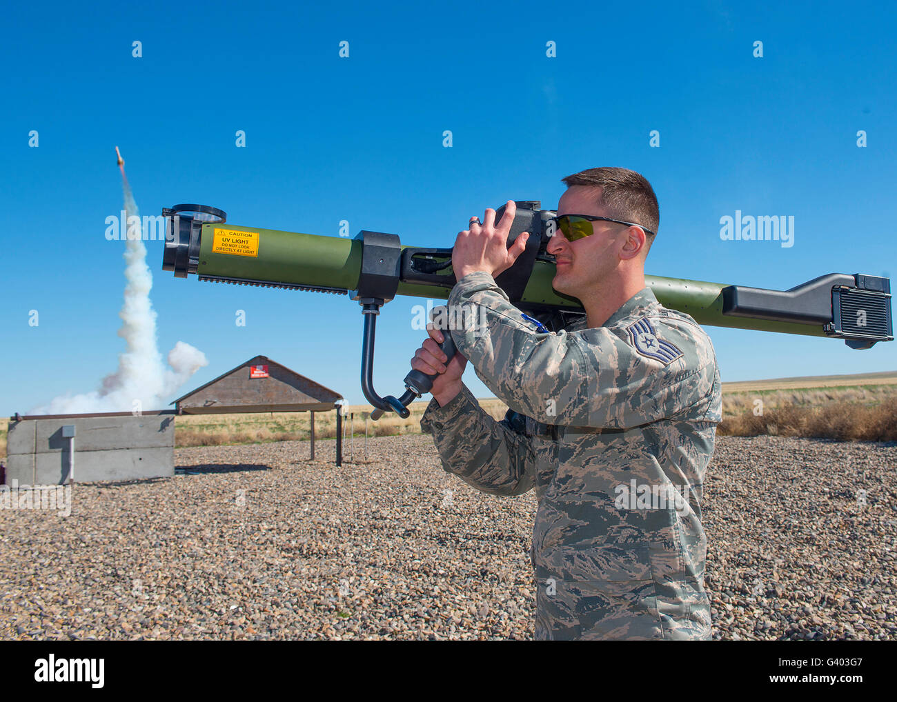 U.S. Soldier fires a man-portable aircraft survivability trainer (MAST). Stock Photo