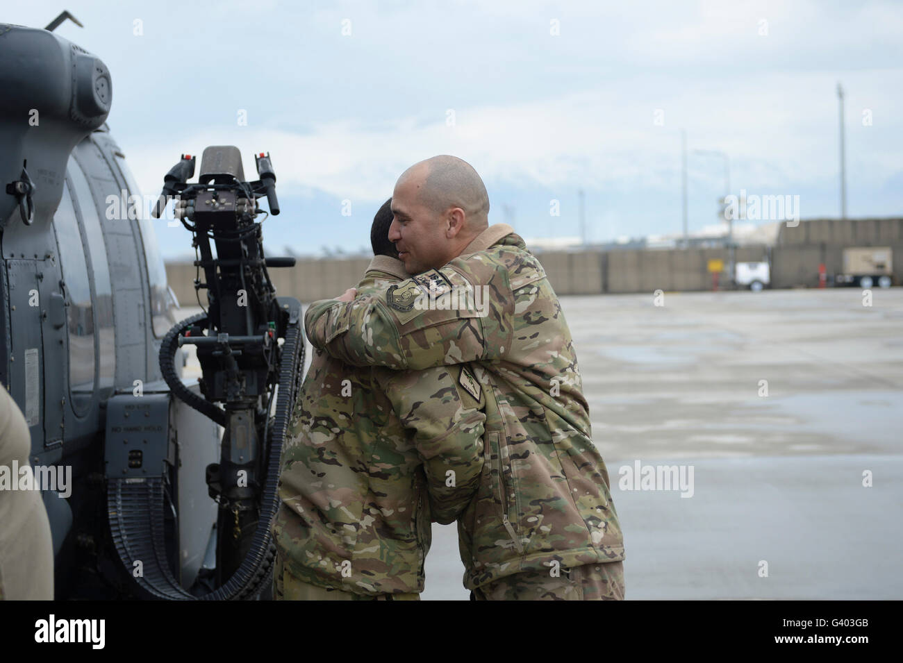 U.S. Air Force flight engineer hugs his father. Stock Photo