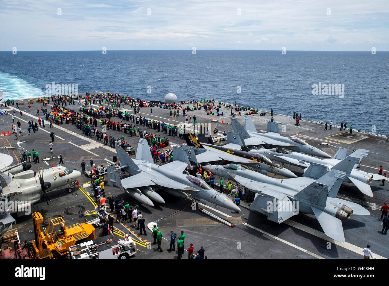 Sailors participate in a steel beach picnic on the flight deck of USS George Washington. Stock Photo