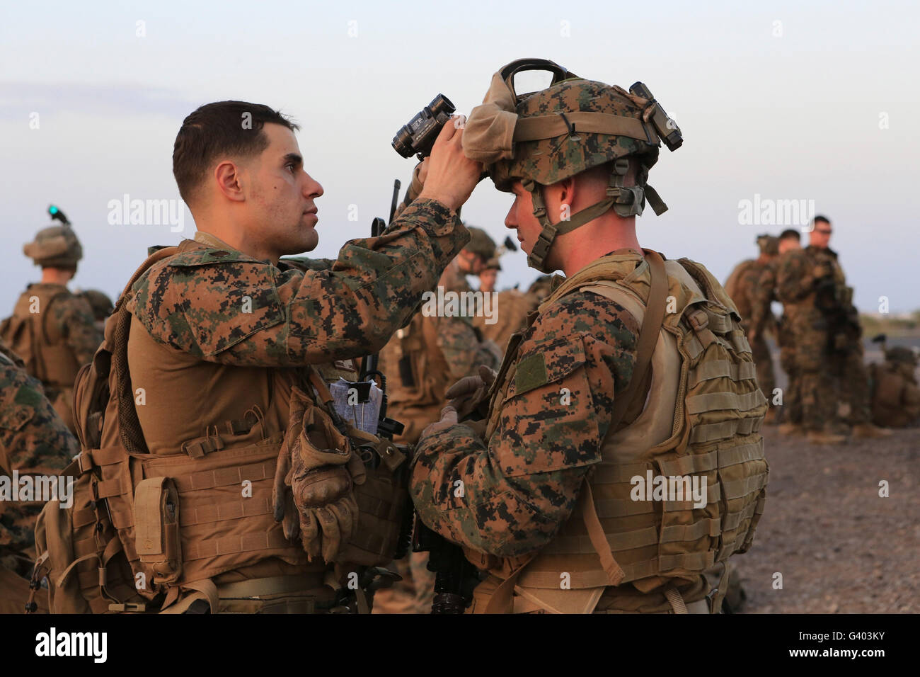 U.S. Marine inspects fellow U.S. Marine's equipment at Camp Lemonnier. Stock Photo