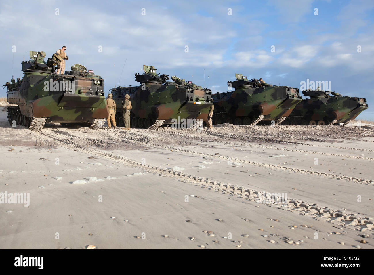 U.S. Marines inspect AAV-P7/A1 amphibious assault vehicles. Stock Photo