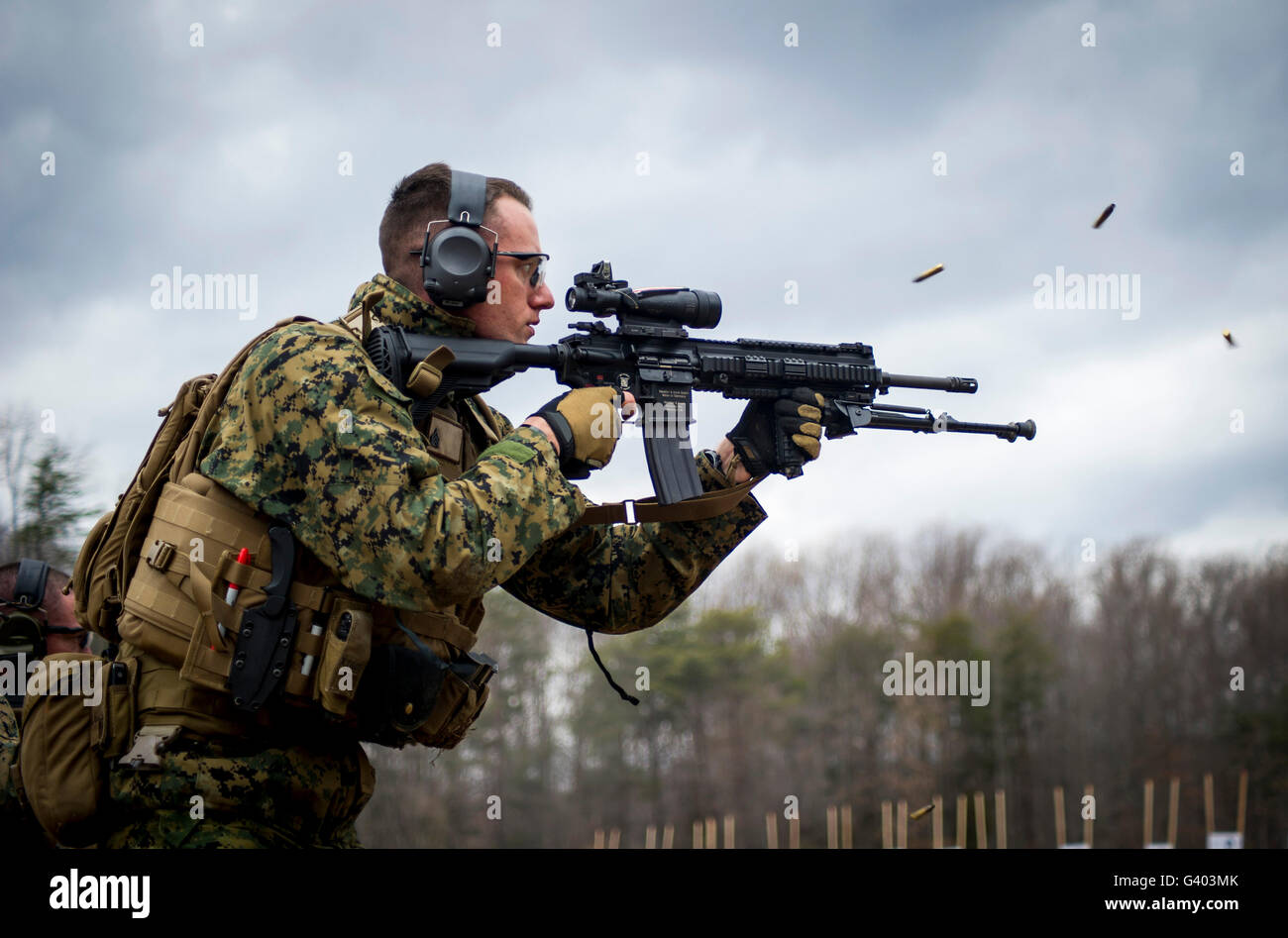 U.S. Marine firing the M27 Infantry Automatic Rifle. Stock Photo