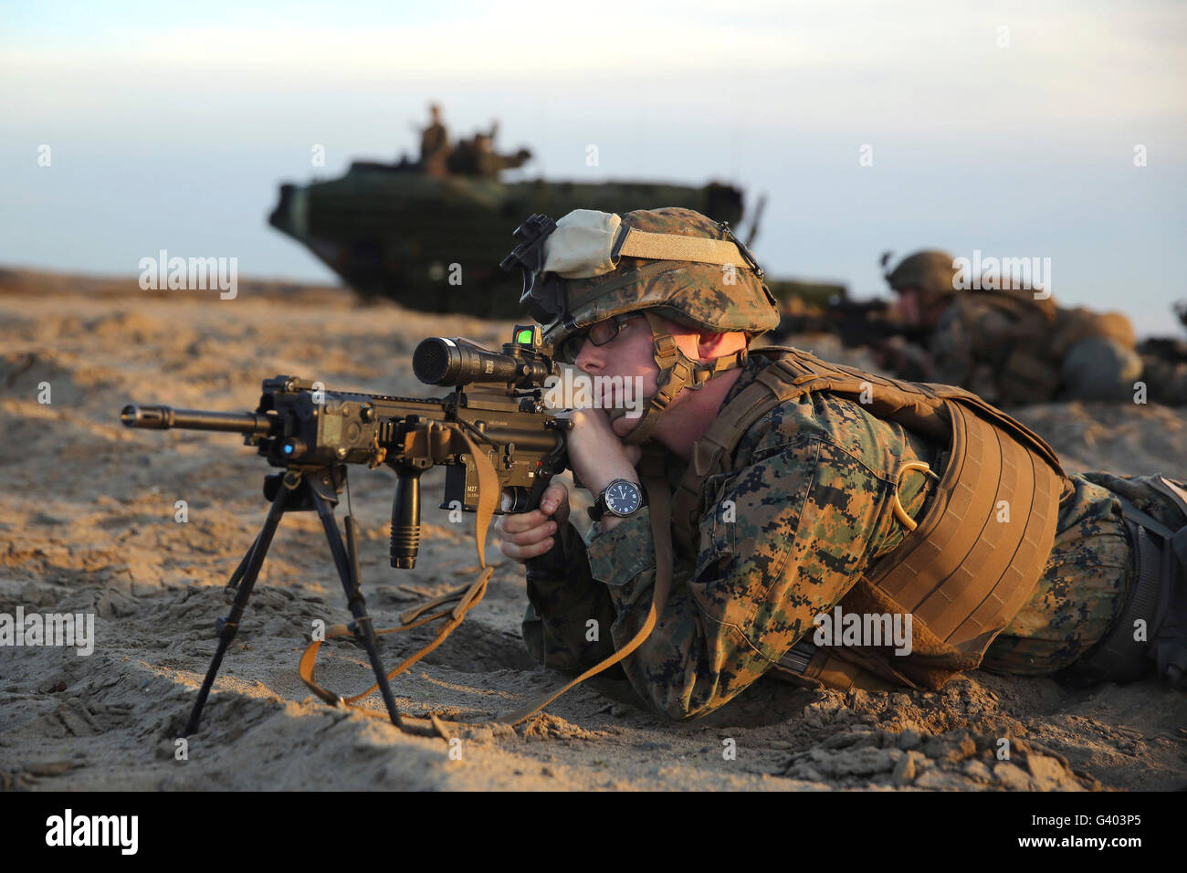 U.S. Marine provides security with his M16 service rifle on Red Beach. Stock Photo
