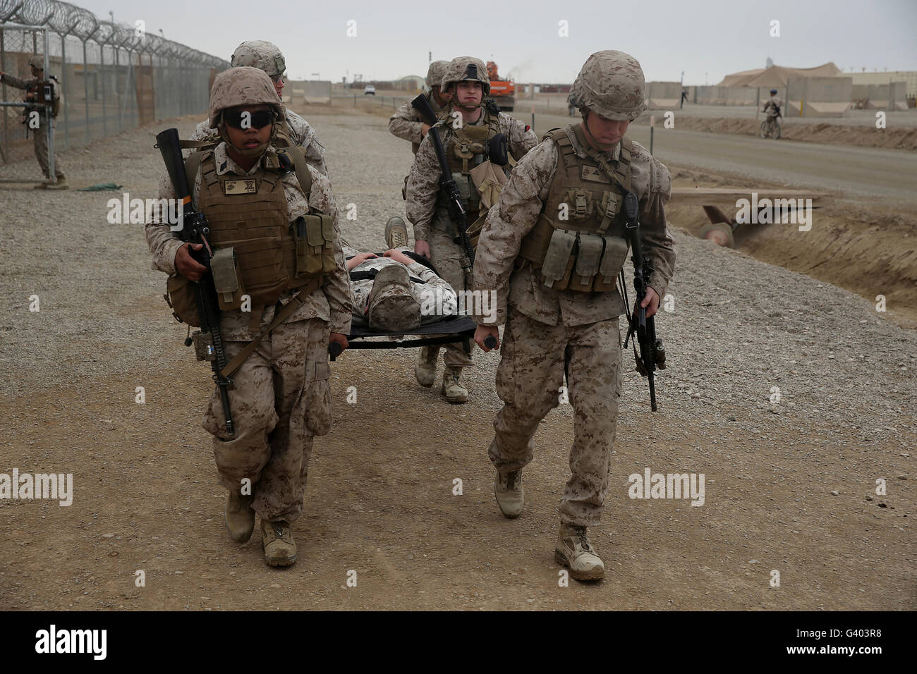 U.S. Marines and Navy corpsmen evacuate a simulated casualty. Stock Photo