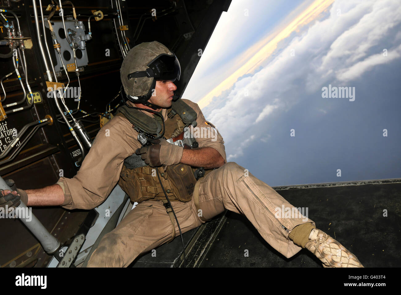 U.S. Marine provides aerial security from a MV-22 Osprey. Stock Photo