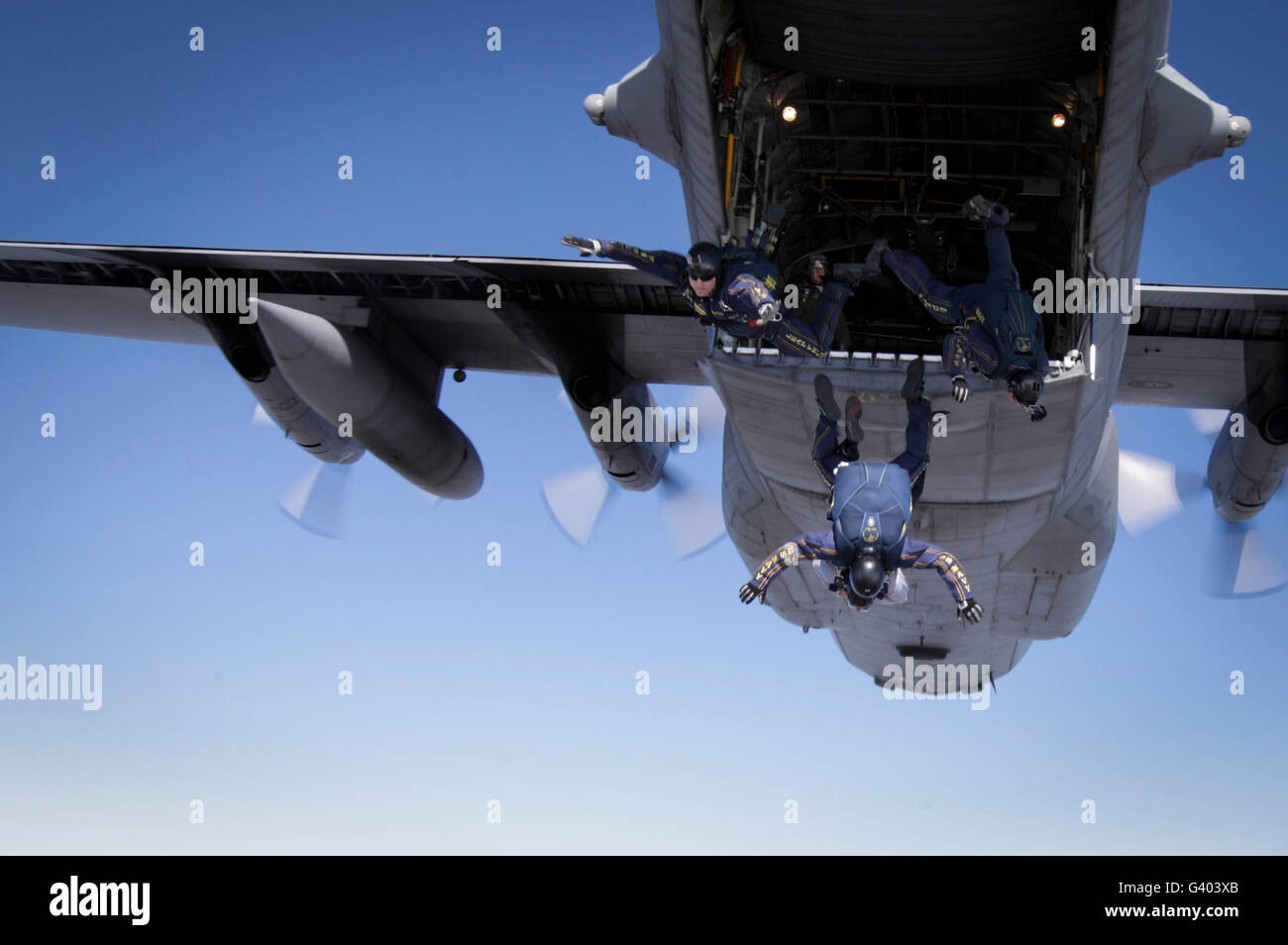 U.S. Navy Parachute Team, the Leap Frogs, jump from a C-130 Hercules. Stock Photo