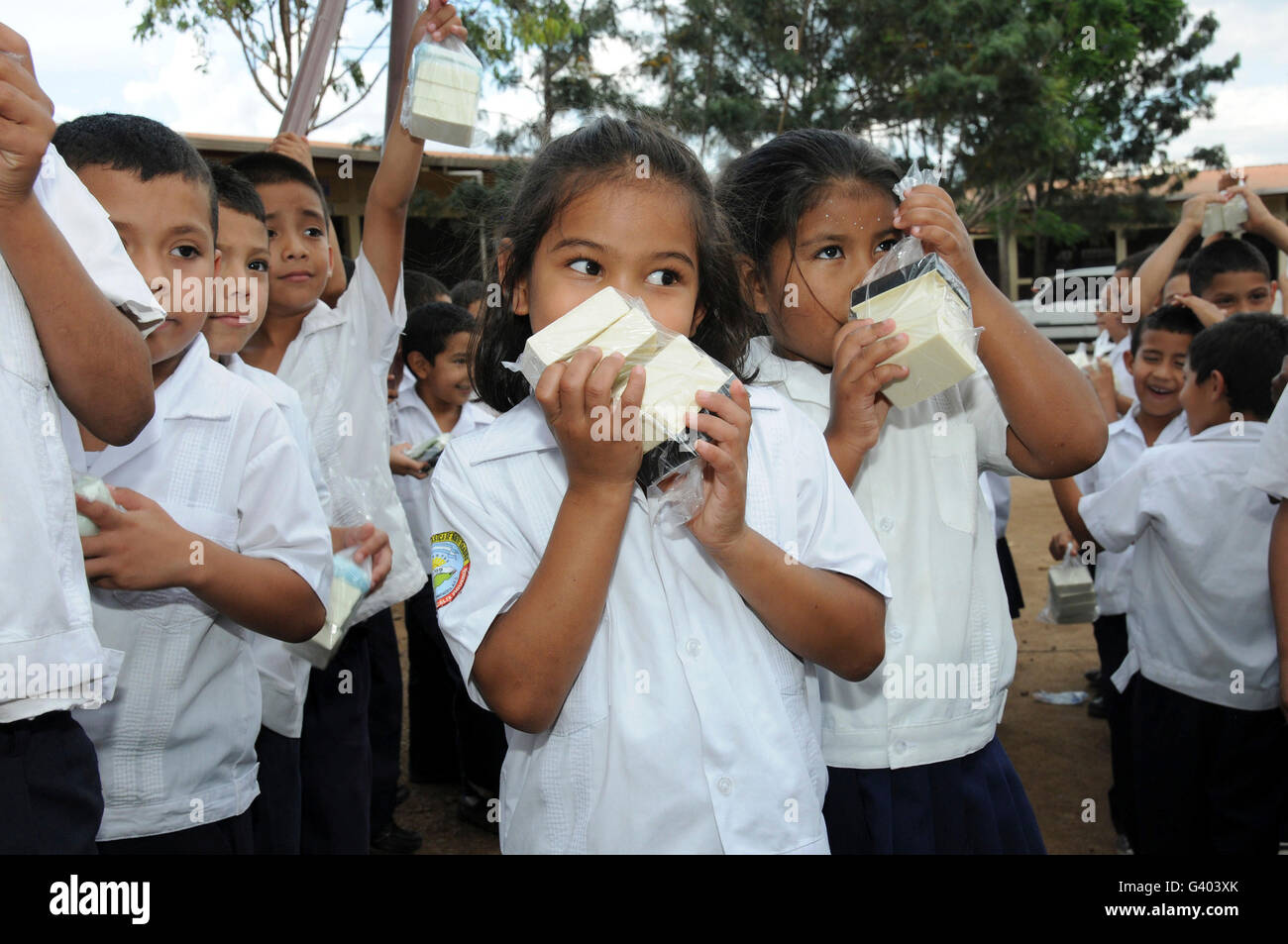 Students enjoy the scent of soap received from humanitarian aid in Tegucigalpa. Stock Photo