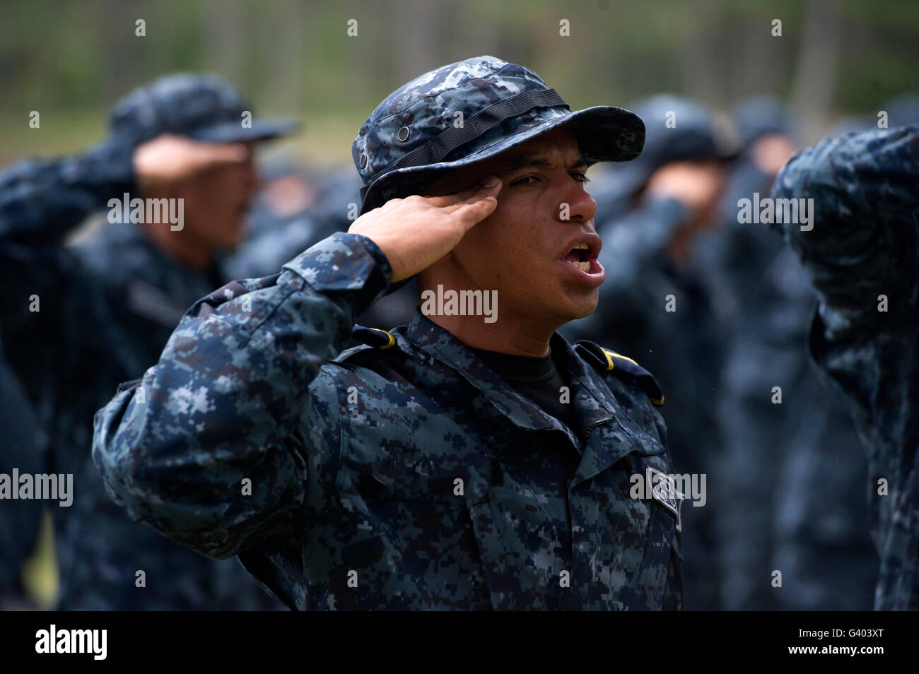 TIGRES commandos sing during their graduation ceremony. Stock Photo