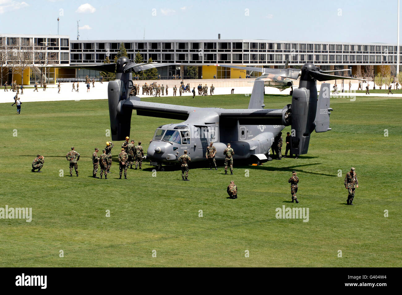 Cadets and active-duty troops swarm around a CV-22 Osprey. Stock Photo