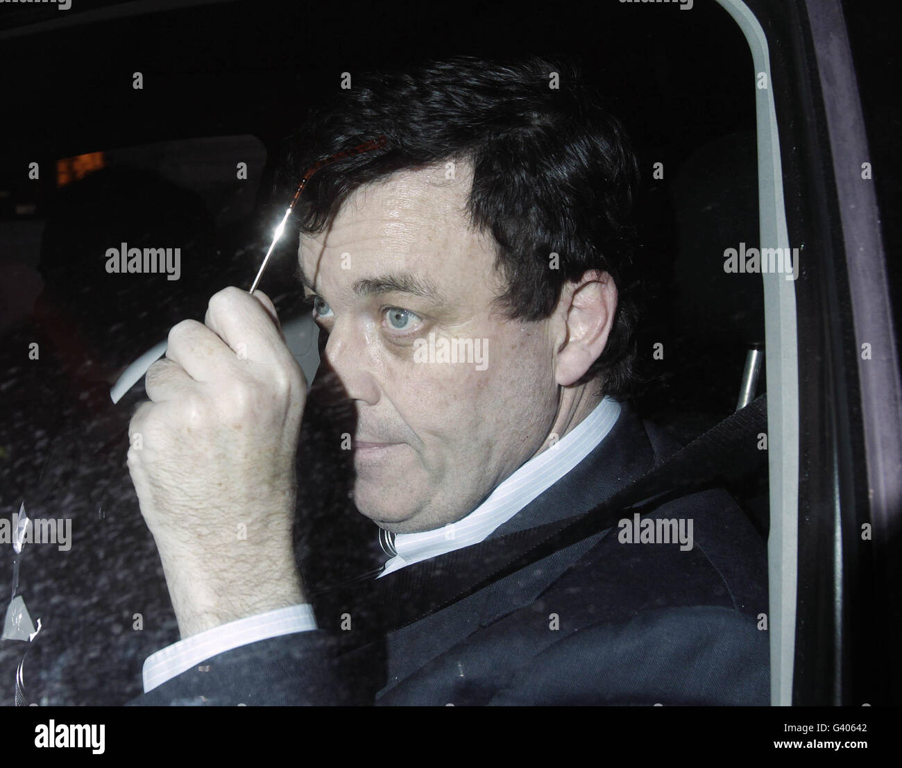 Finance Minister Brian Lenihan leaving Government Buildings in Dublin. Taoiseach Brian Cowen warned opponents that there was no vacancy in his office as he offered to sit down with disgruntled party colleagues over his under-fire leadership. Stock Photo