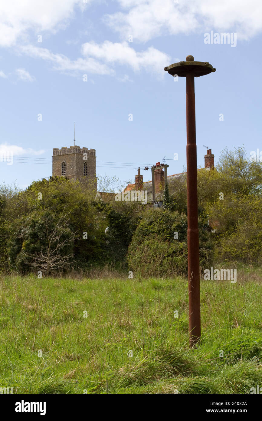 A rusty mysterious pole in a Suffolk village that possibly is disused children's play equipment Stock Photo