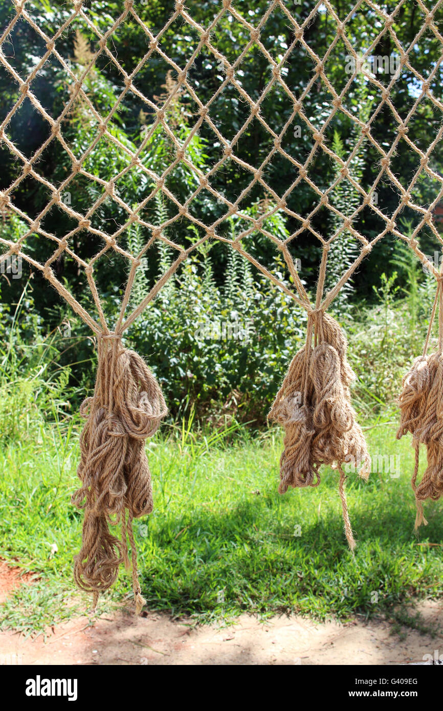 Weaving a fishing net Stock Photo Alamy