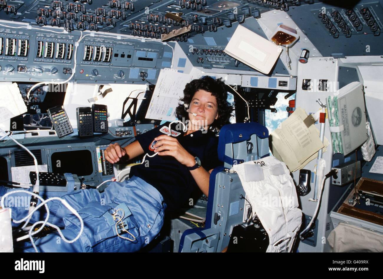 American astronaut Sally Ride floats in microgravity in the flight deck during Space Shuttle Challenger STS-7 mission June 18, 1983 in Earth Orbit. Ride became the first American woman to fly in space during the mission. Stock Photo