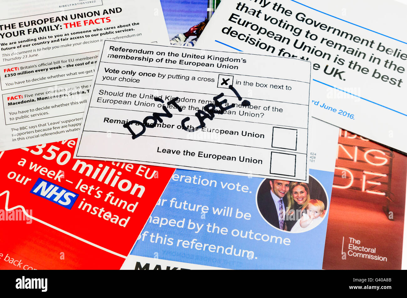 UK Referendum voting slip with 'Don't Care' written on it as a spoiled vote of apathy on top of campaign literature from both the 'leave' (Brexit) and 'remain' (Bremain) camps (mock voting slip) Stock Photo