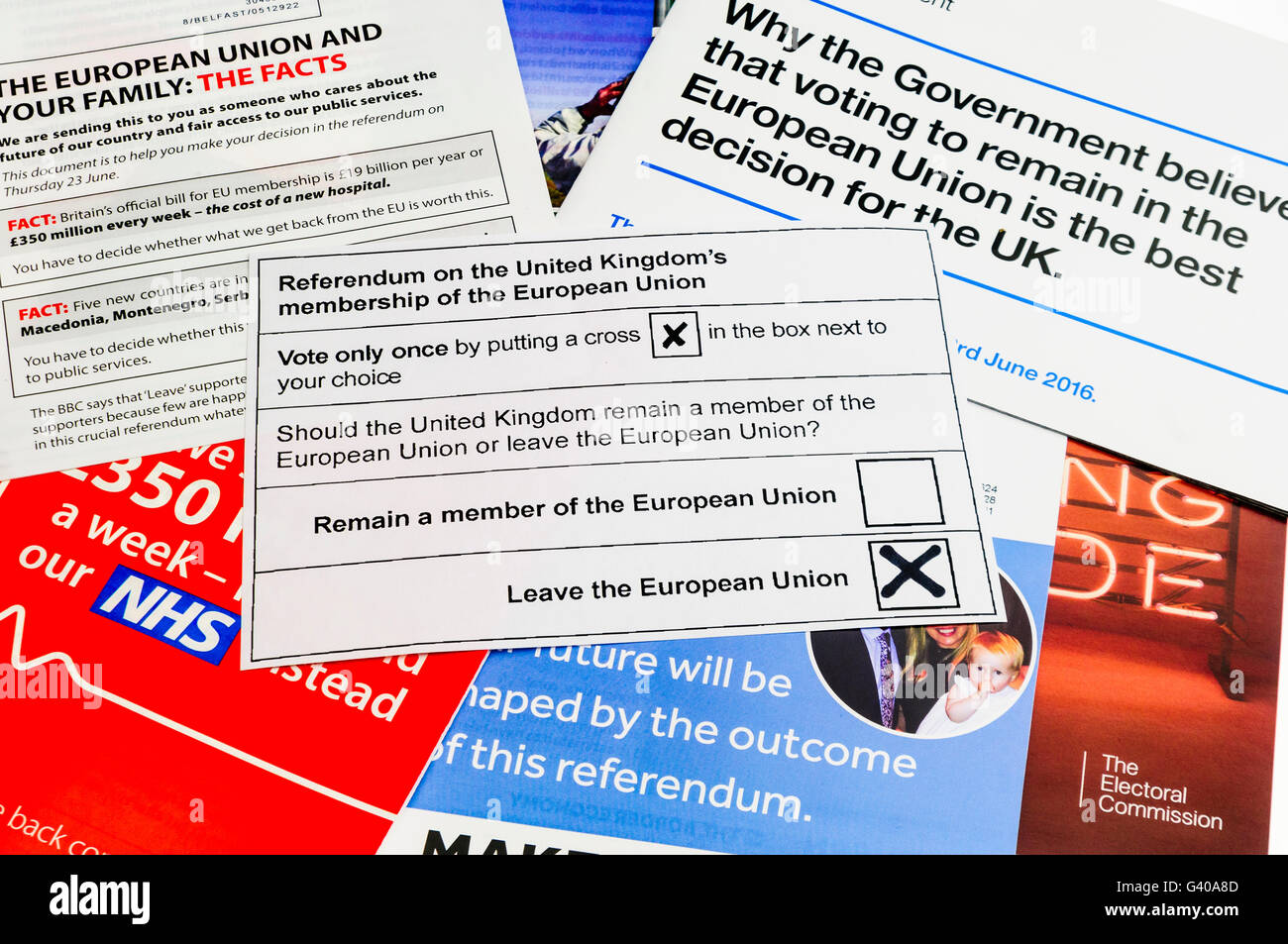 UK Referendum voting slip with a vote to leave the European Union on top of campaign literature from both the 'leave' (Brexit) and 'remain' (Bremain) camps (mock voting slip) Stock Photo
