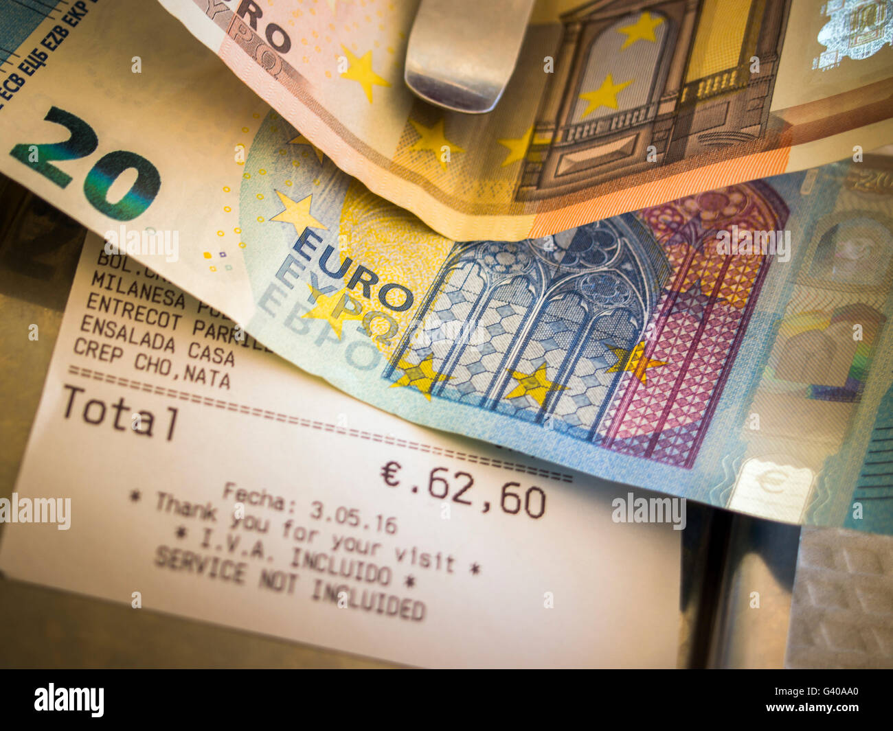 Restaurant bill with euro coins Stock Photo
