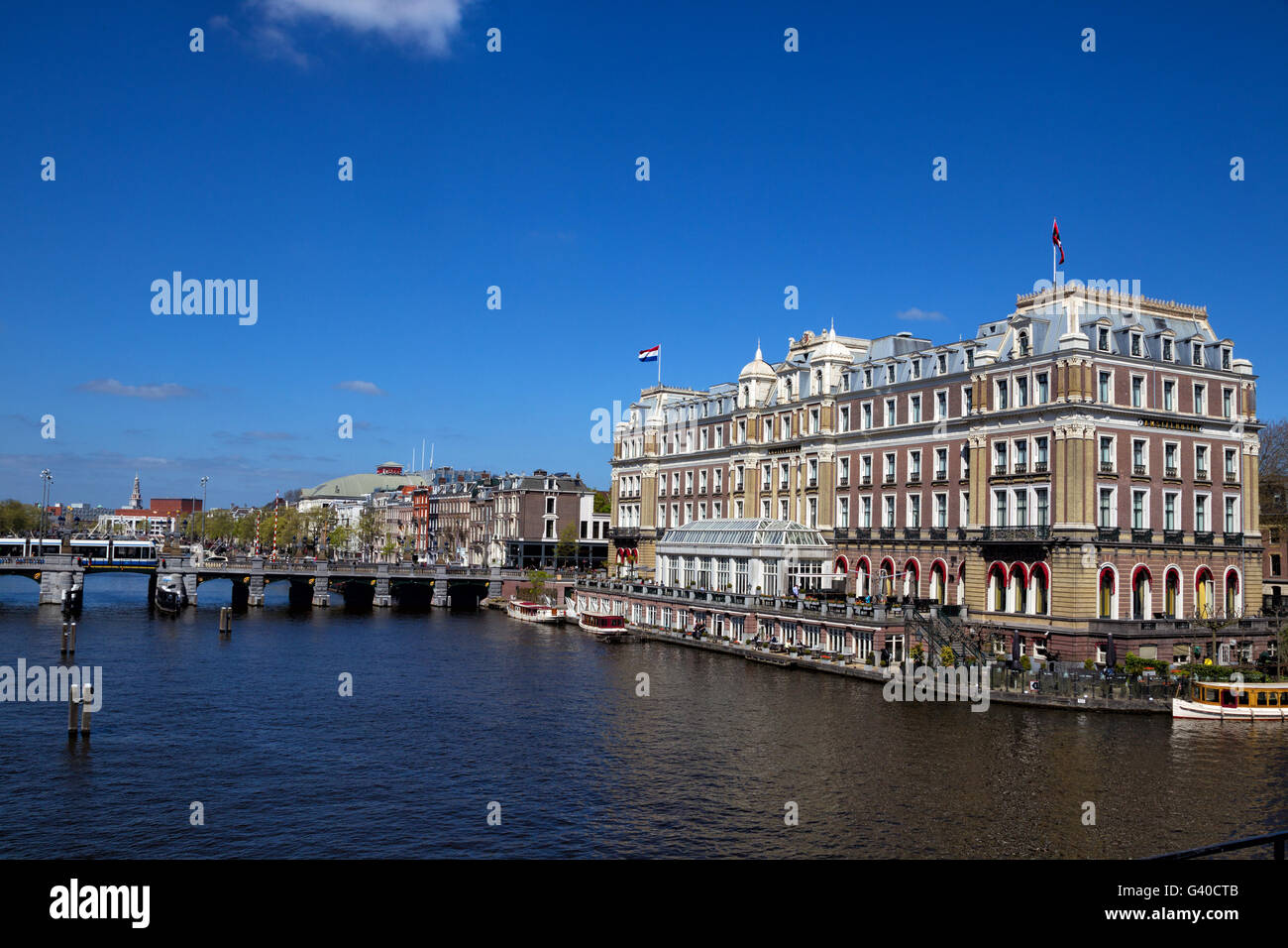 Intercontinental Amstel Hotel at the Amstel river in downtown Amsterdam, Netherlands in spring. Stock Photo