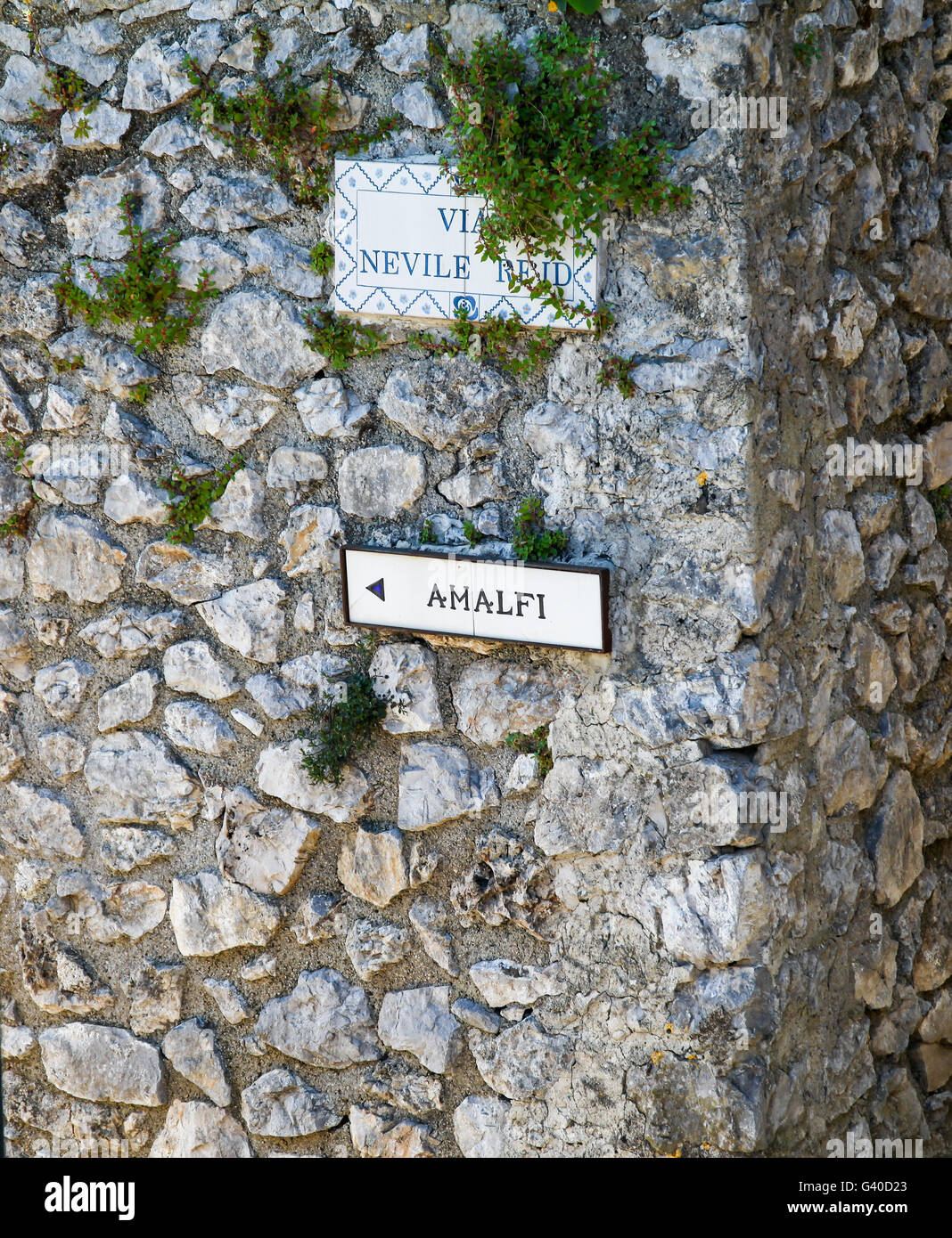 A sign on a wall saying Amalfi Stock Photo