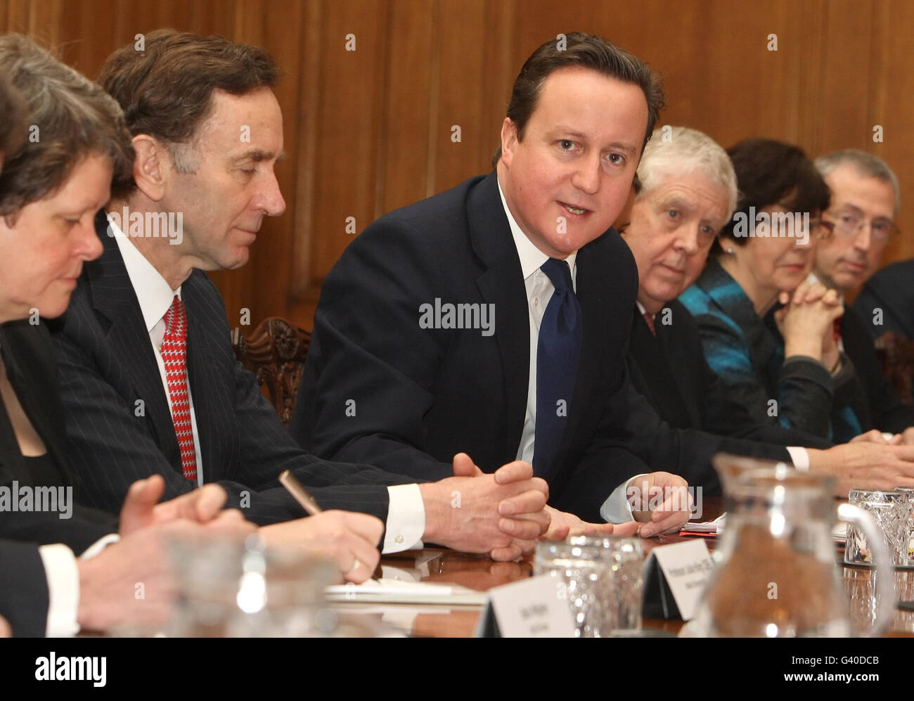Prime Minister David Cameron and Minister for Trade and Investment Lord Green (second left) arrive at a meeting of business ambassadors at 10 Downing Street, London. Stock Photo