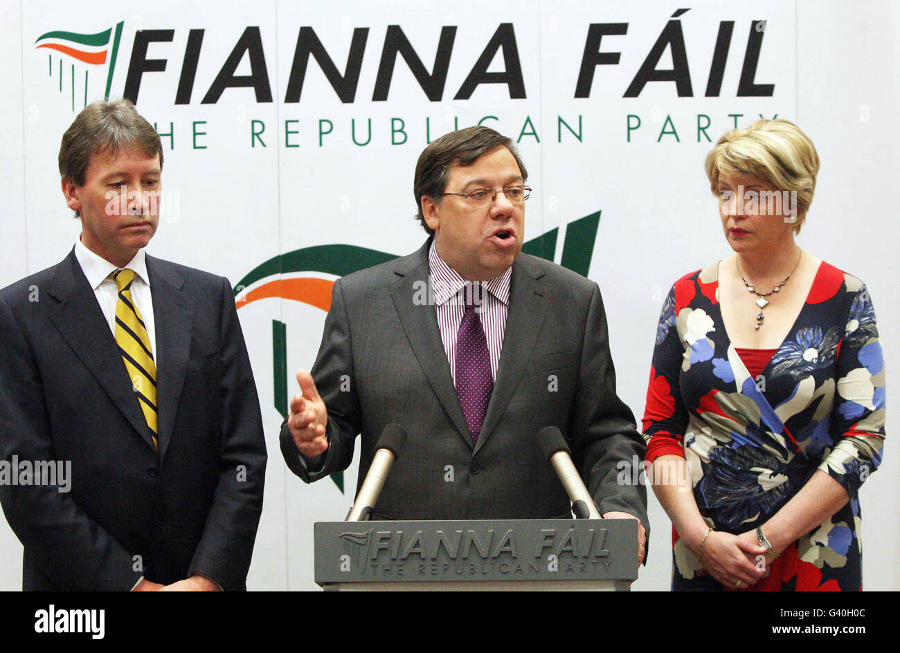 Taoiseach Brian Cowen speaks to the media during a press conference, flanked by Party Chief Whip John Curran and Tanaiste Mary Coughlan, at the Alexander Hotel in Dublin, where he confirmed he would remain as leader of his ruling Fianna Fail party. Stock Photo