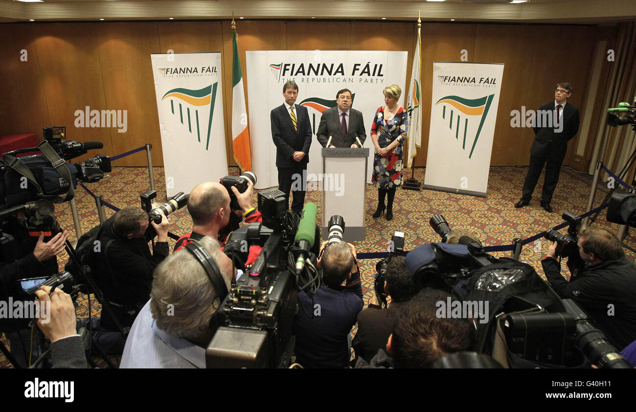 Taoiseach Brian Cowen, flanked by Party Chief Whip John Curran and Tanaiste Mary Coughlan, speaks to the media during a press conference at the Alexander Hotel in Dublin, where he confirmed he would remain as leader of his ruling Fianna Fail party. Stock Photo