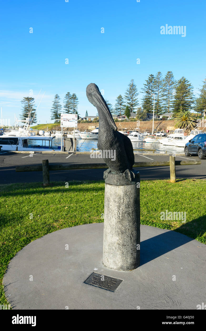 A bronze-mix statue by artist Tim Johnman, in memory of a pelican that ate a plastic bag and died in Kiama Harbour, New South Wales, NSW, Australia Stock Photo