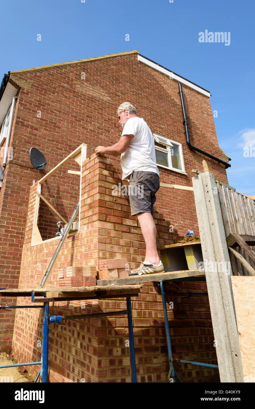 Builder building house extension, UK. Stock Photo