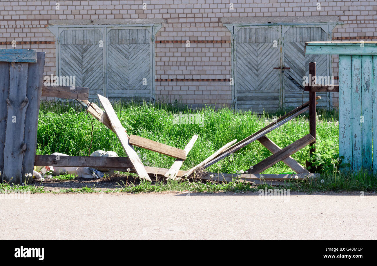 Broken damaged wooden fence panels with nobody Stock Photo
