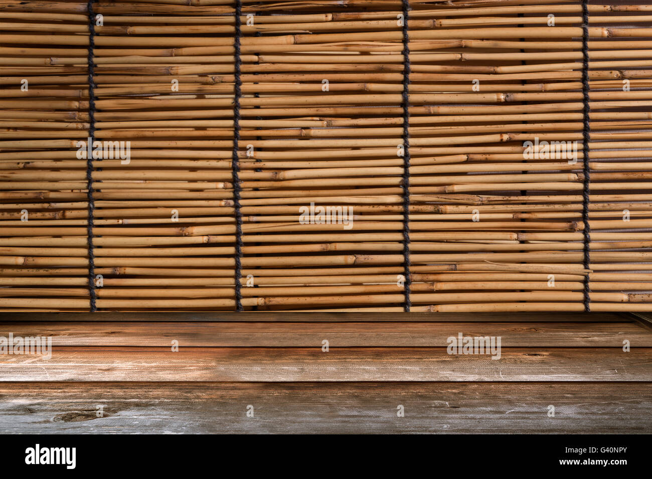 Wood tabletop in perspective view with bamboo curtain retro background Stock Photo