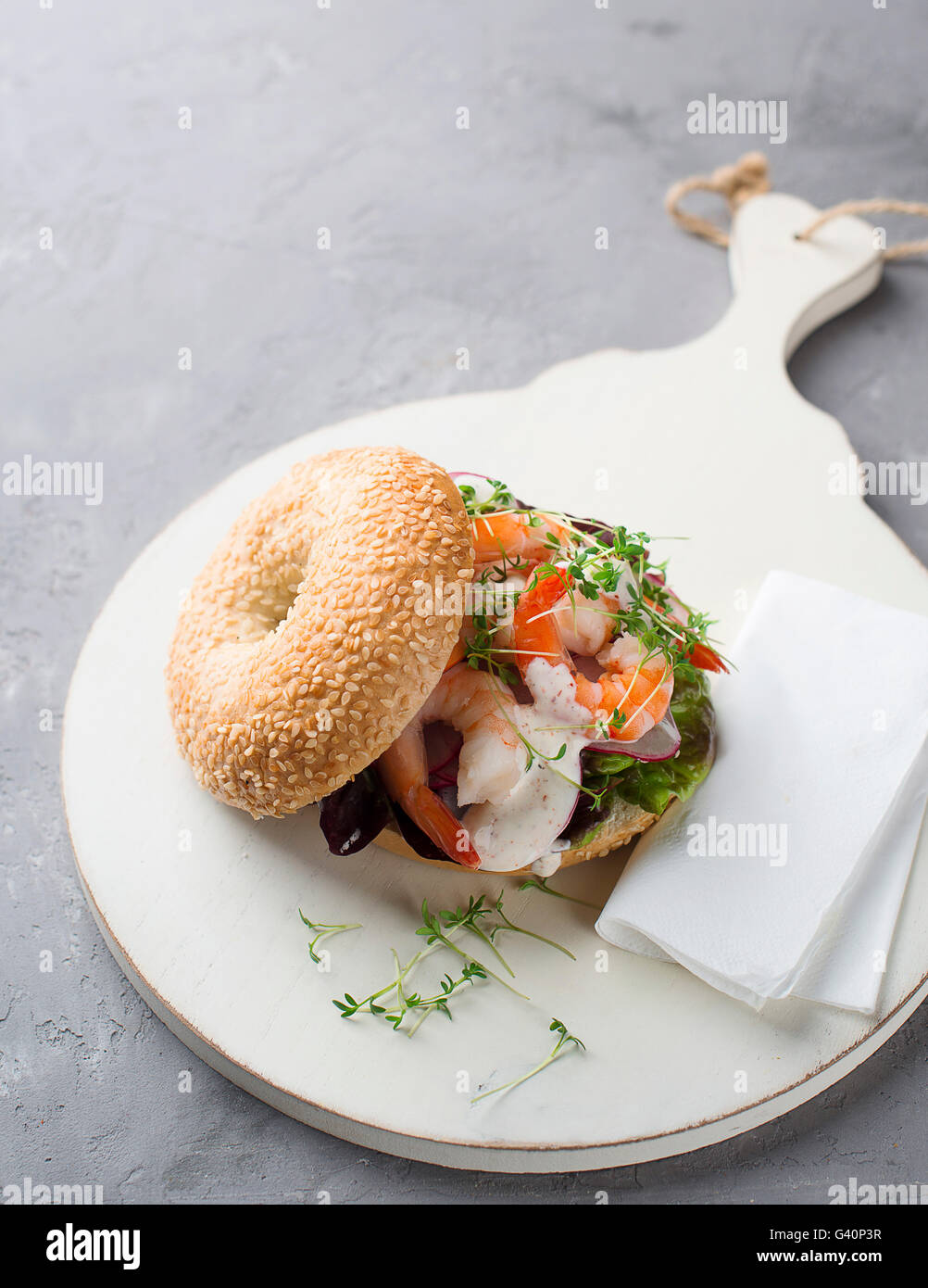 Bagel with shrimp and radish Stock Photo